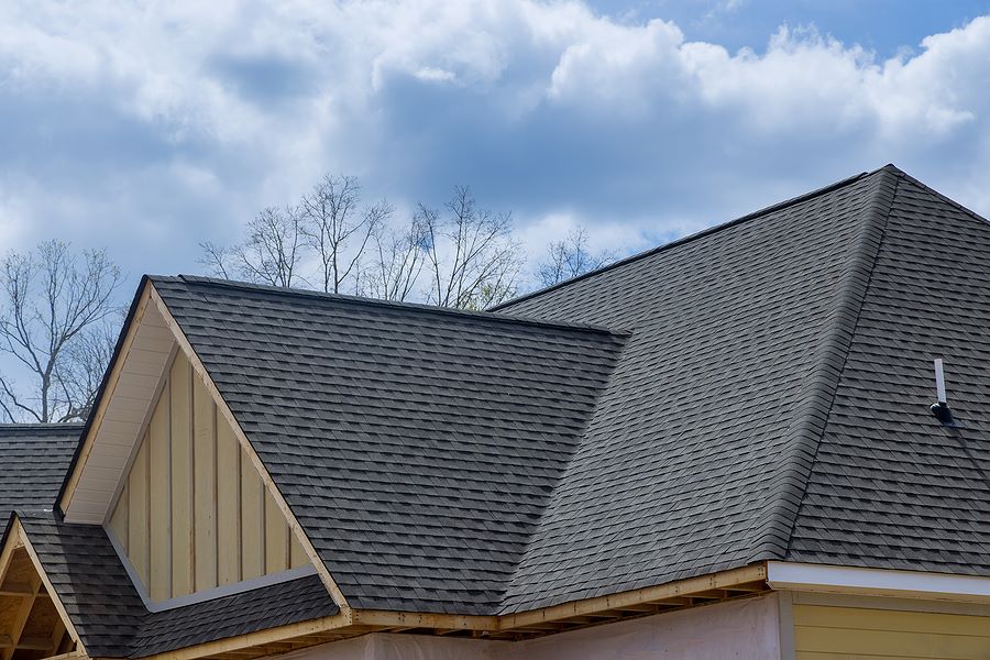 Arial view of a newly installed gray roof on residential home