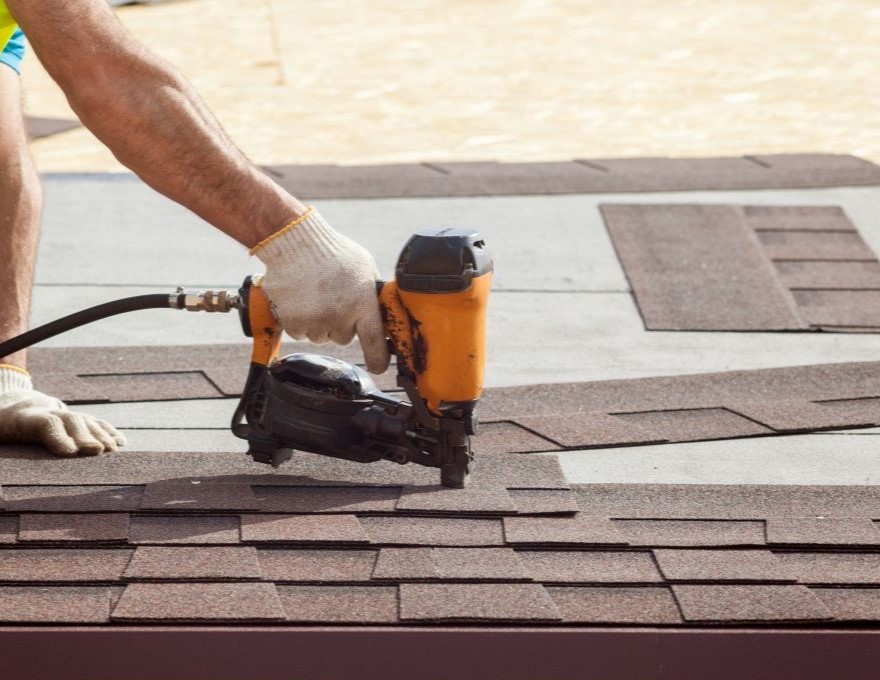Stock image installing a residential roof top